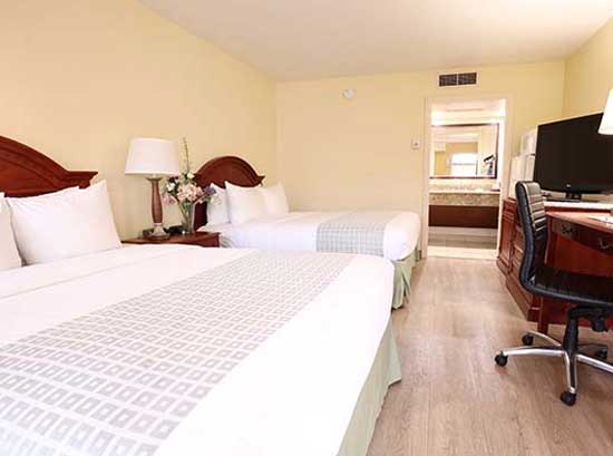 Santa Clara Biltmore Hotel & Suites - Silicon Valley Standard Room features two queen sized or one king sized bed and various amenities.